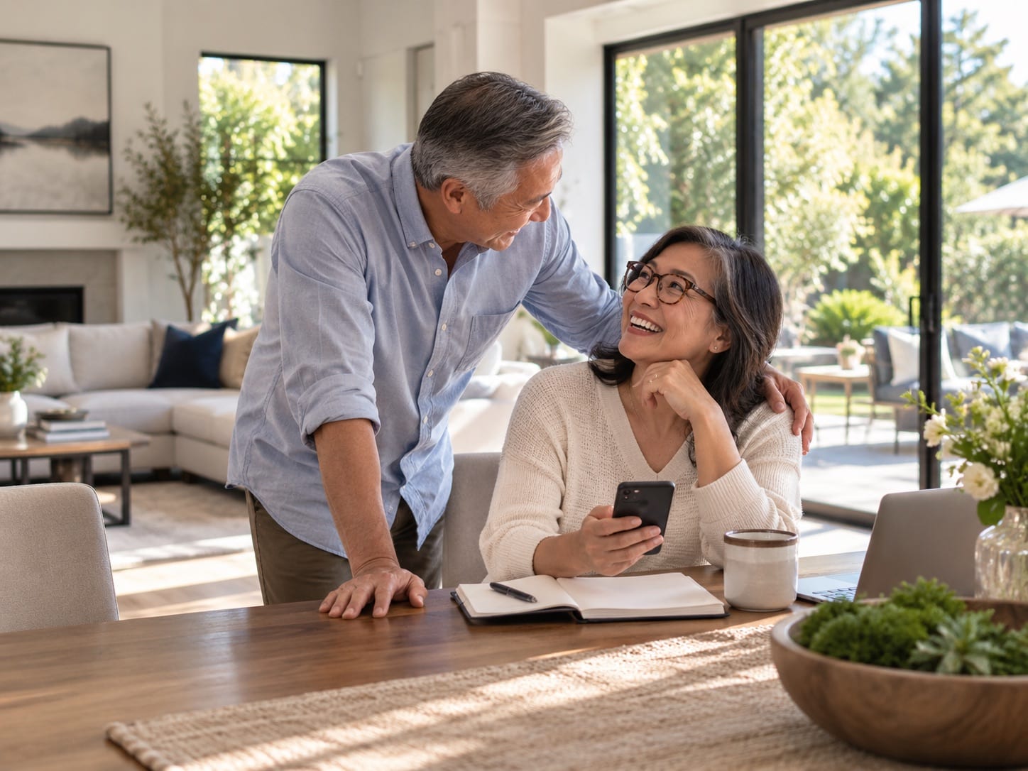 Couple reviewing an offer together at their kitchen table